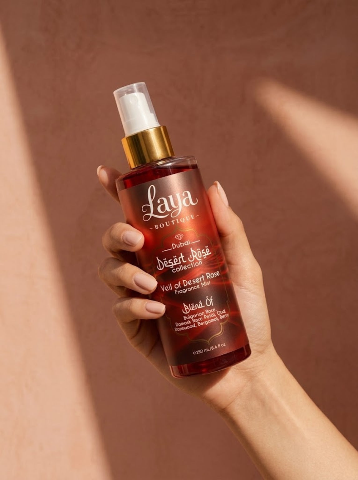 Veil of Desert Rose fragrance mist in hand