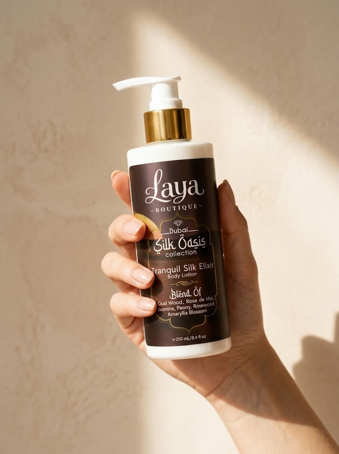 Tranquil Silk Elixir body lotion in hand